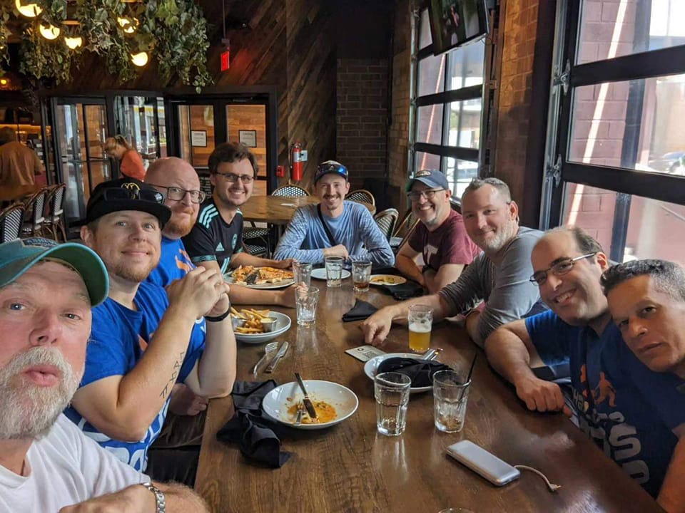 Queen City Dads Group Around the Table